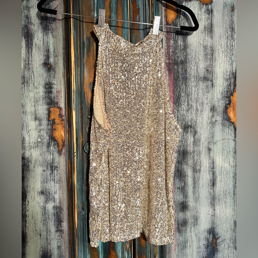 Sequin tank, neck hugger, low sleeves. Party wear or casual